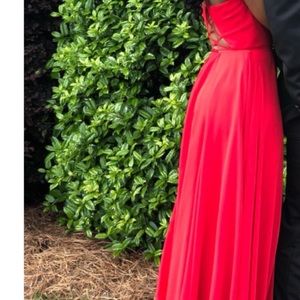 Red Faviana prom grown. Only worn once. Size two